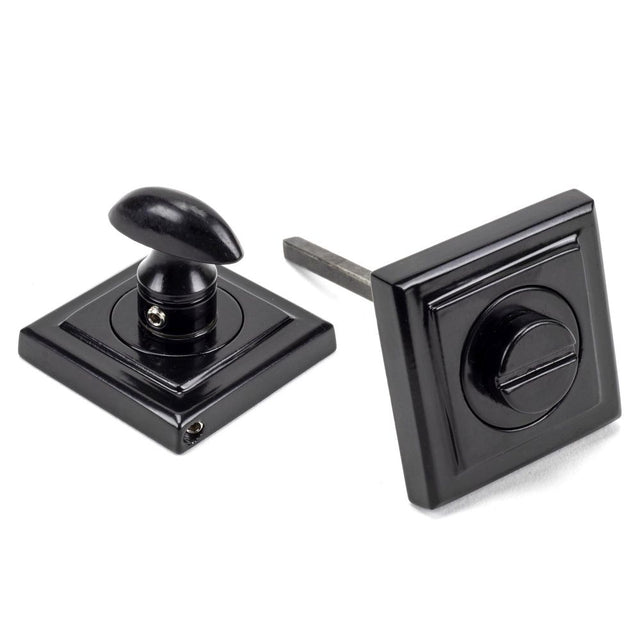 This is an image showing From The Anvil - Black Round Thumbturn Set (Square) available from trade door handles, quick delivery and discounted prices