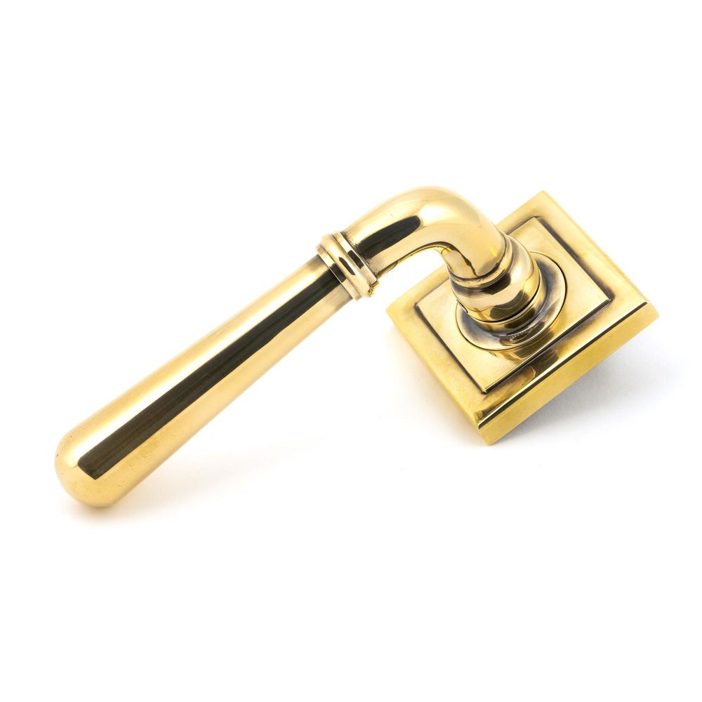 This is an image showing From The Anvil - Aged Brass Newbury Lever on Rose Set (Square) available from trade door handles, quick delivery and discounted prices