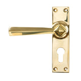 This is an image showing From The Anvil - Polished Brass Straight Lever Euro Lock Set available from trade door handles, quick delivery and discounted prices