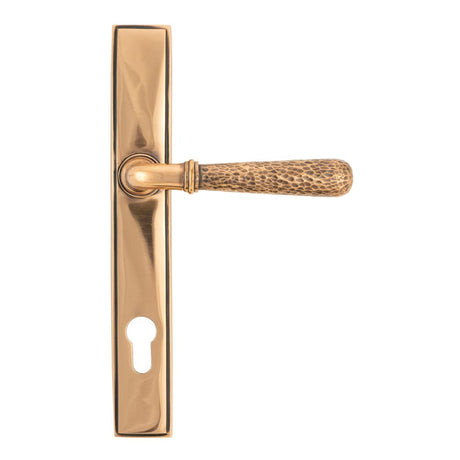 This is an image showing From The Anvil - Polished Bronze Hammered Newbury Slimline Espag. Lock Set available from trade door handles, quick delivery and discounted prices