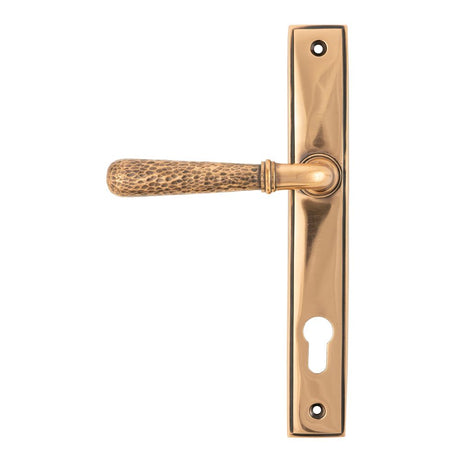 This is an image showing From The Anvil - Polished Bronze Hammered Newbury Slimline Espag. Lock Set available from trade door handles, quick delivery and discounted prices