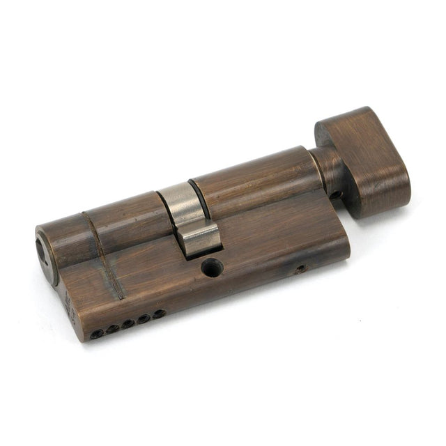 This is an image showing From The Anvil - Aged Brass 35/35 5pin Euro Cylinder/Thumbturn available from trade door handles, quick delivery and discounted prices