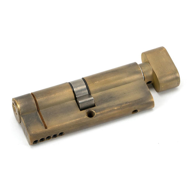 This is an image showing From The Anvil - Aged Brass 40/40 5pin Euro Cylinder/Thumbturn available from trade door handles, quick delivery and discounted prices