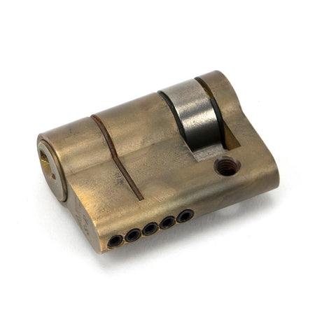 This is an image showing From The Anvil - Aged Brass 30/10 5pin Single Cylinder available from trade door handles, quick delivery and discounted prices