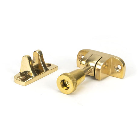 This is an image showing From The Anvil - Polished Brass Brompton Brighton Fastener (Radiused) available from trade door handles, quick delivery and discounted prices