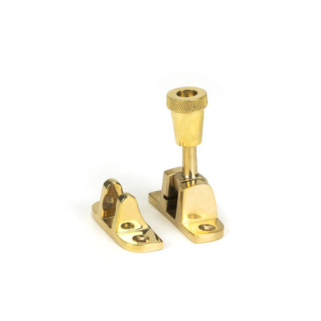 This is an image showing From The Anvil - Polished Brass Brompton Brighton Fastener (Radiused) available from trade door handles, quick delivery and discounted prices