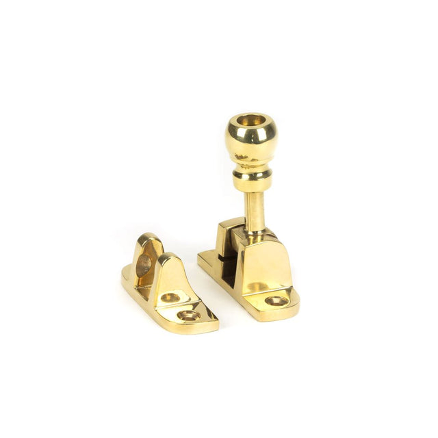 This is an image showing From The Anvil - Polished Brass Mushroom Brighton Fastener (Radiused) available from trade door handles, quick delivery and discounted prices