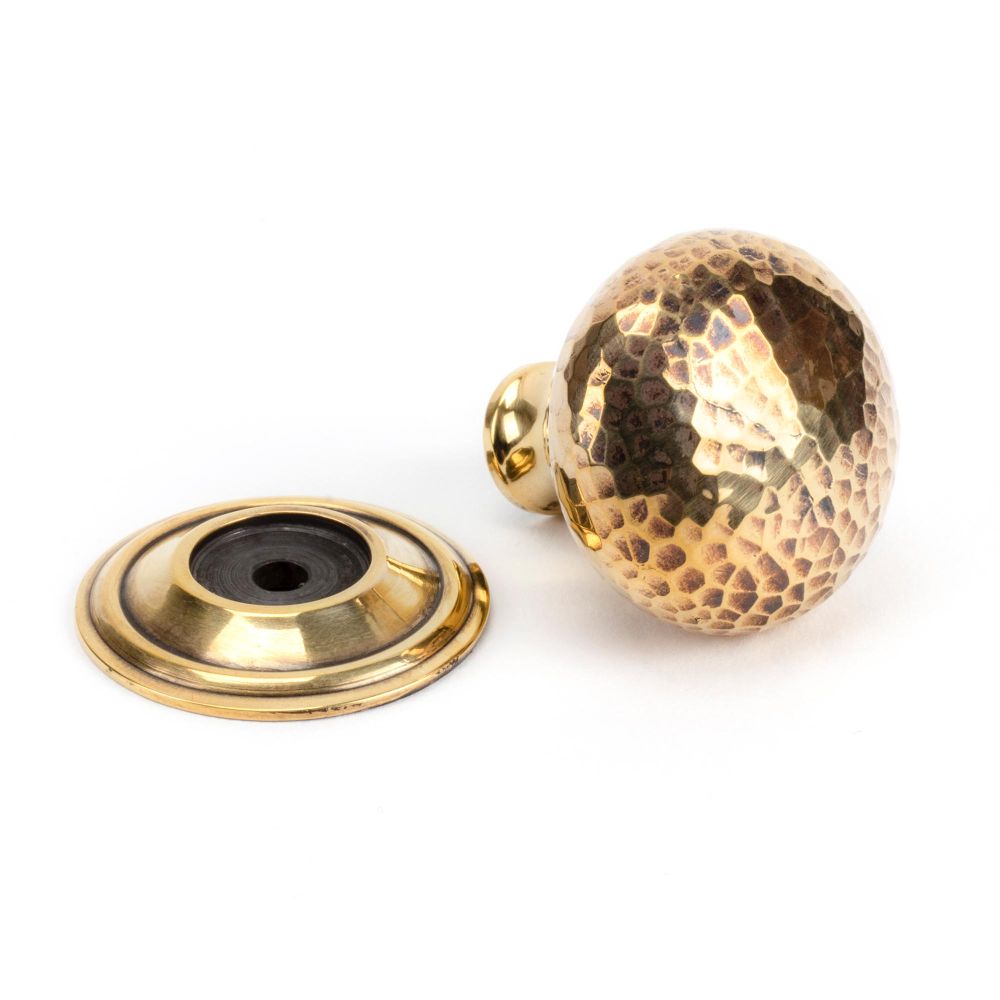 This is an image showing From The Anvil - Aged Brass Hammered Mushroom Cabinet Knob 32mm available from trade door handles, quick delivery and discounted prices