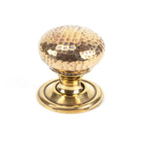 This is an image showing From The Anvil - Aged Brass Hammered Mushroom Cabinet Knob 32mm available from trade door handles, quick delivery and discounted prices