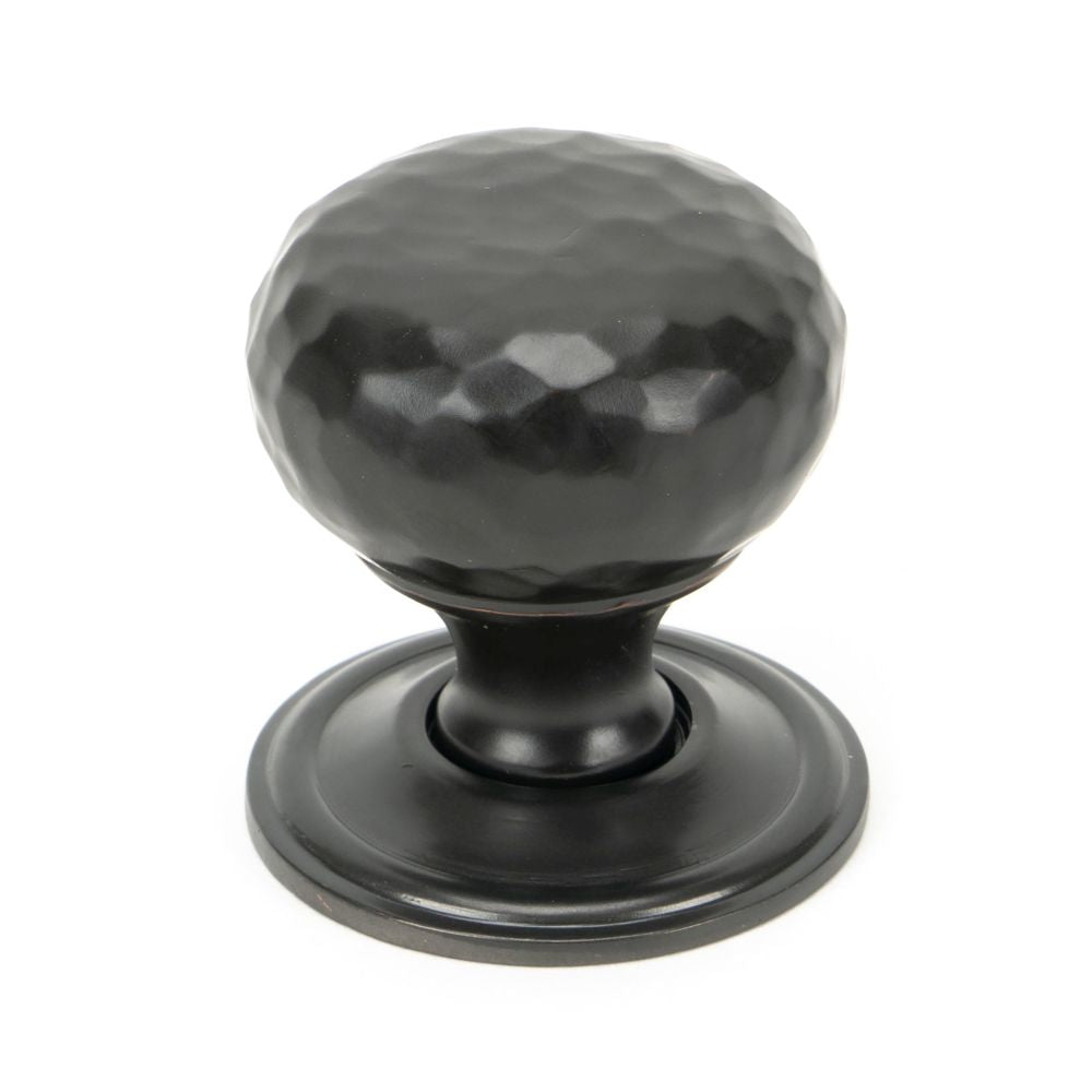 This is an image showing From The Anvil - Aged Bronze Hammered Mushroom Cabinet Knob 32mm available from trade door handles, quick delivery and discounted prices