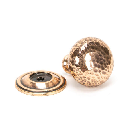 This is an image showing From The Anvil - Polished Bronze Hammered Mushroom Cabinet Knob 32mm available from trade door handles, quick delivery and discounted prices