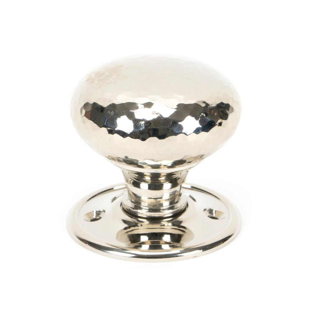 This is an image showing From The Anvil - Polished Nickel Hammered Mushroom Mortice/Rim Knob Set available from trade door handles, quick delivery and discounted prices