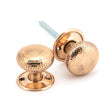 This is an image showing From The Anvil - Polished Bronze Hammered Mushroom Mortice/Rim Knob Set available from trade door handles, quick delivery and discounted prices