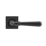 This is an image showing From The Anvil - Aged Bronze Newbury Lever on Rose Set (Square) available from trade door handles, quick delivery and discounted prices