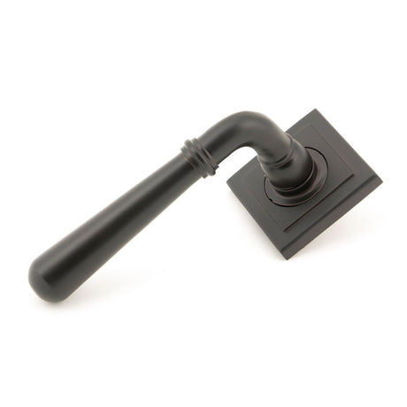 This is an image showing From The Anvil - Aged Bronze Newbury Lever on Rose Set (Square) available from trade door handles, quick delivery and discounted prices