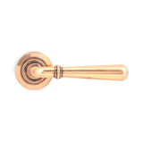 This is an image showing From The Anvil - Polished Bronze Newbury Lever on Rose Set (Plain) available from trade door handles, quick delivery and discounted prices