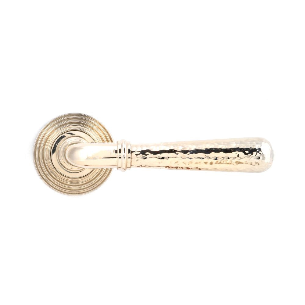 This is an image showing From The Anvil - Pol. Nickel Hammered Newbury Lever on Rose Set (Beehive) available from trade door handles, quick delivery and discounted prices