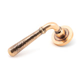 This is an image showing From The Anvil - Pol. Bronze Hammered Newbury Lever on Rose Set (Plain) available from trade door handles, quick delivery and discounted prices