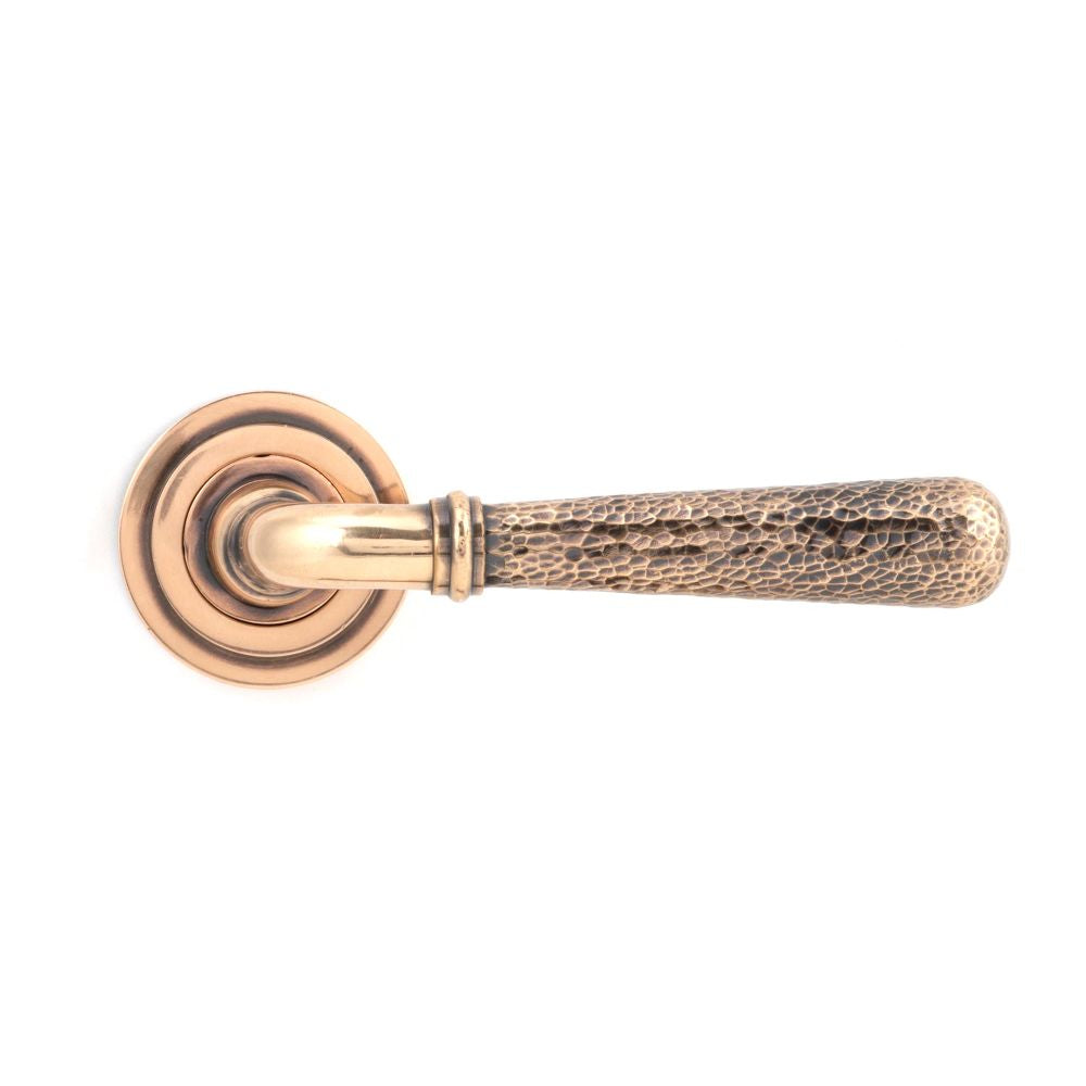 This is an image showing From The Anvil - Pol. Bronze Hammered Newbury Lever on Rose Set (Art Deco) available from trade door handles, quick delivery and discounted prices