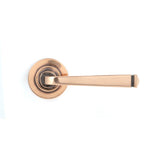 This is an image showing From The Anvil - Polished Bronze Avon Round Lever on Rose Set (Plain) available from trade door handles, quick delivery and discounted prices