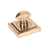 This is an image showing From The Anvil - Polished Bronze Round Thumbturn Set (Square) available from trade door handles, quick delivery and discounted prices