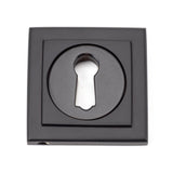 This is an image showing From The Anvil - Aged Bronze Round Escutcheon (Square) available from trade door handles, quick delivery and discounted prices