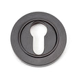 This is an image showing From The Anvil - Aged Bronze Round Euro Escutcheon (Plain) available from trade door handles, quick delivery and discounted prices