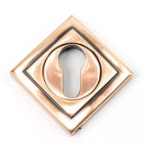 This is an image showing From The Anvil - Polished Bronze Round Euro Escutcheon (Square) available from trade door handles, quick delivery and discounted prices