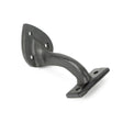 This is an image showing From The Anvil - Beeswax 2" Handrail Bracket available from trade door handles, quick delivery and discounted prices