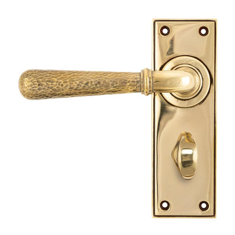 This is an image showing From The Anvil - Aged Brass Hammered Newbury Lever Bathroom Set available from trade door handles, quick delivery and discounted prices