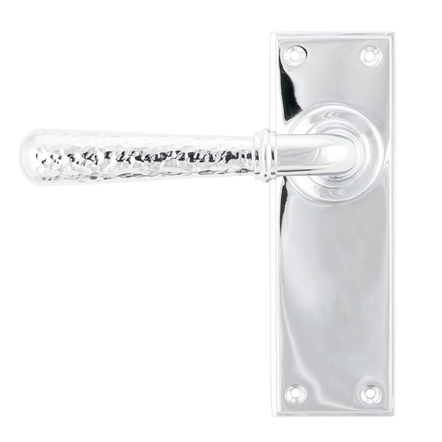 This is an image showing From The Anvil - Polished Chrome Hammered Newbury Lever Latch Set available from trade door handles, quick delivery and discounted prices