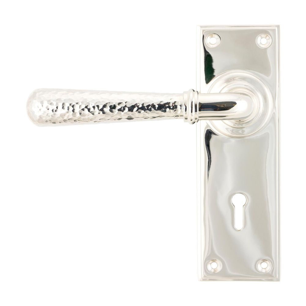 This is an image showing From The Anvil - Polished Nickel Hammered Newbury Lever Lock Set available from trade door handles, quick delivery and discounted prices