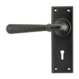 This is an image showing From The Anvil - Aged Bronze Hammered Newbury Lever Lock Set available from trade door handles, quick delivery and discounted prices