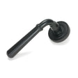 This is an image showing From The Anvil - Matt Black Newbury Lever on Rose Set (Art Deco) available from trade door handles, quick delivery and discounted prices