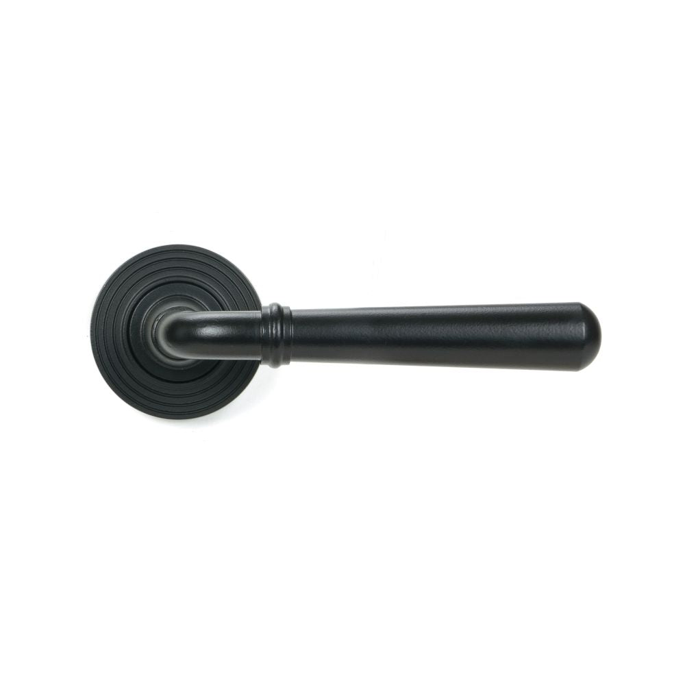 This is an image showing From The Anvil - Matt Black Newbury Lever on Rose Set (Beehive) available from trade door handles, quick delivery and discounted prices