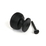 This is an image showing From The Anvil - Matt Black Beehive Cabinet Knob 30mm available from trade door handles, quick delivery and discounted prices