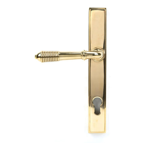 This is an image showing From The Anvil - Polished Brass Reeded Slimline Lever Espag. Lock Set available from trade door handles, quick delivery and discounted prices