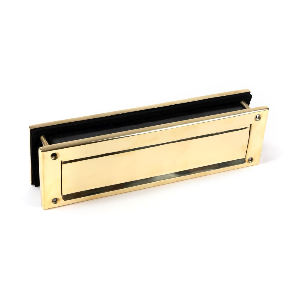 This is an image showing From The Anvil - Polished Brass Traditional Letterbox available from trade door handles, quick delivery and discounted prices