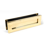 This is an image showing From The Anvil - Polished Brass Traditional Letterbox available from trade door handles, quick delivery and discounted prices