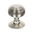 This is an image showing From The Anvil - Polished Nickel Beehive Centre Door Knob available from trade door handles, quick delivery and discounted prices
