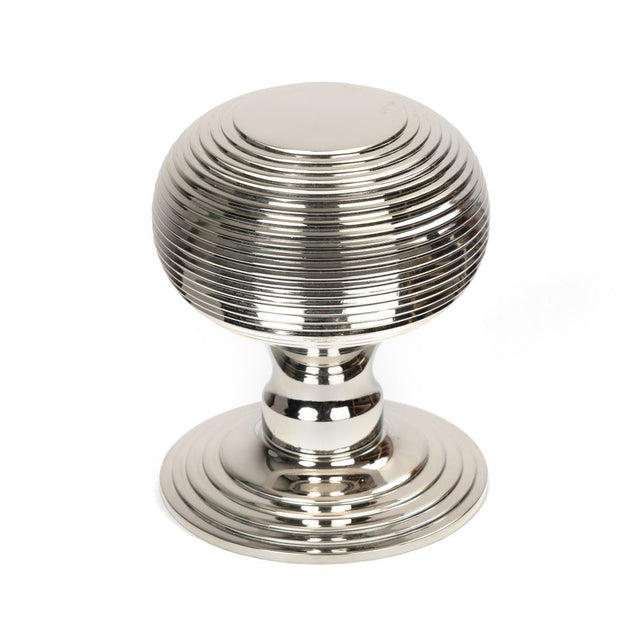 This is an image showing From The Anvil - Polished Nickel Beehive Centre Door Knob available from trade door handles, quick delivery and discounted prices