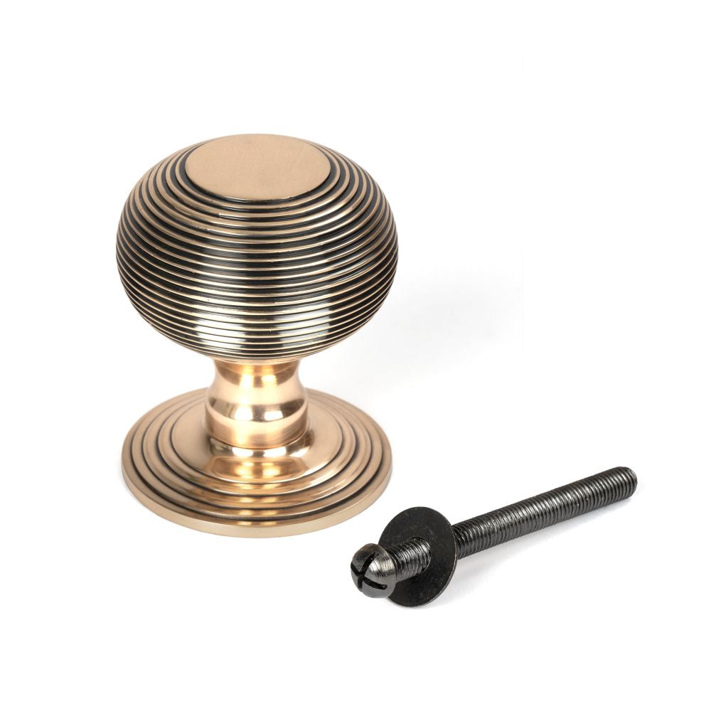 This is an image showing From The Anvil - Polished Bronze Beehive Centre Door Knob available from trade door handles, quick delivery and discounted prices