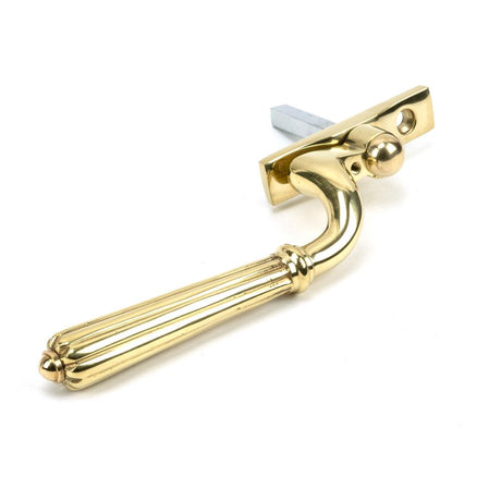 This is an image showing From The Anvil - Polished Brass Hinton Espag - RH available from trade door handles, quick delivery and discounted prices