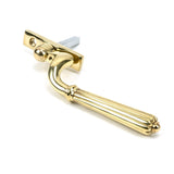 This is an image showing From The Anvil - Polished Brass Hinton Espag - LH available from trade door handles, quick delivery and discounted prices