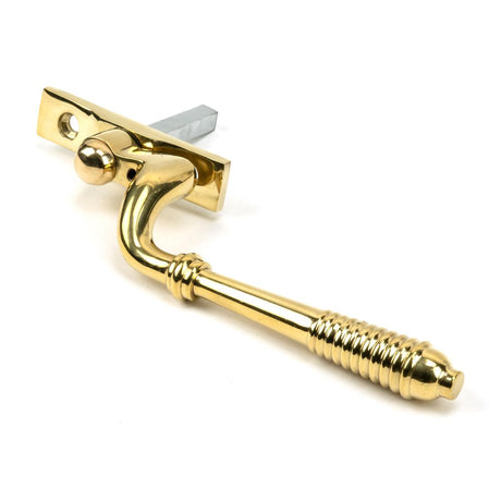 This is an image showing From The Anvil - Polished Brass Reeded Espag - LH available from trade door handles, quick delivery and discounted prices