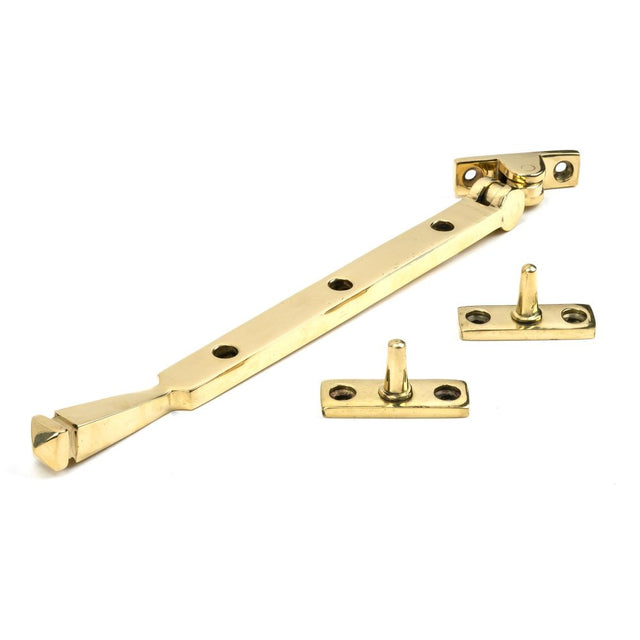 This is an image showing From The Anvil - Polished Brass 10" Avon Stay available from trade door handles, quick delivery and discounted prices