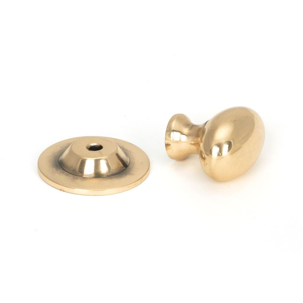 This is an image showing From The Anvil - Polished Bronze Oval Cabinet Knob 33mm available from trade door handles, quick delivery and discounted prices