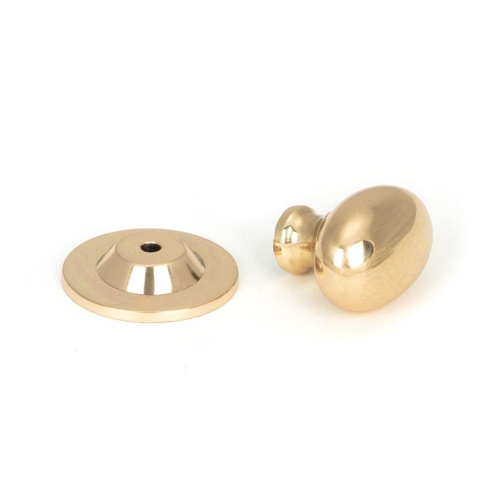 This is an image showing From The Anvil - Polished Bronze Oval Cabinet Knob 40mm available from trade door handles, quick delivery and discounted prices