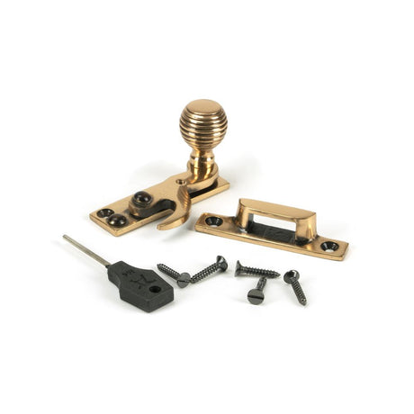 This is an image showing From The Anvil - Polished Bronze Beehive Sash Hook Fastener available from trade door handles, quick delivery and discounted prices