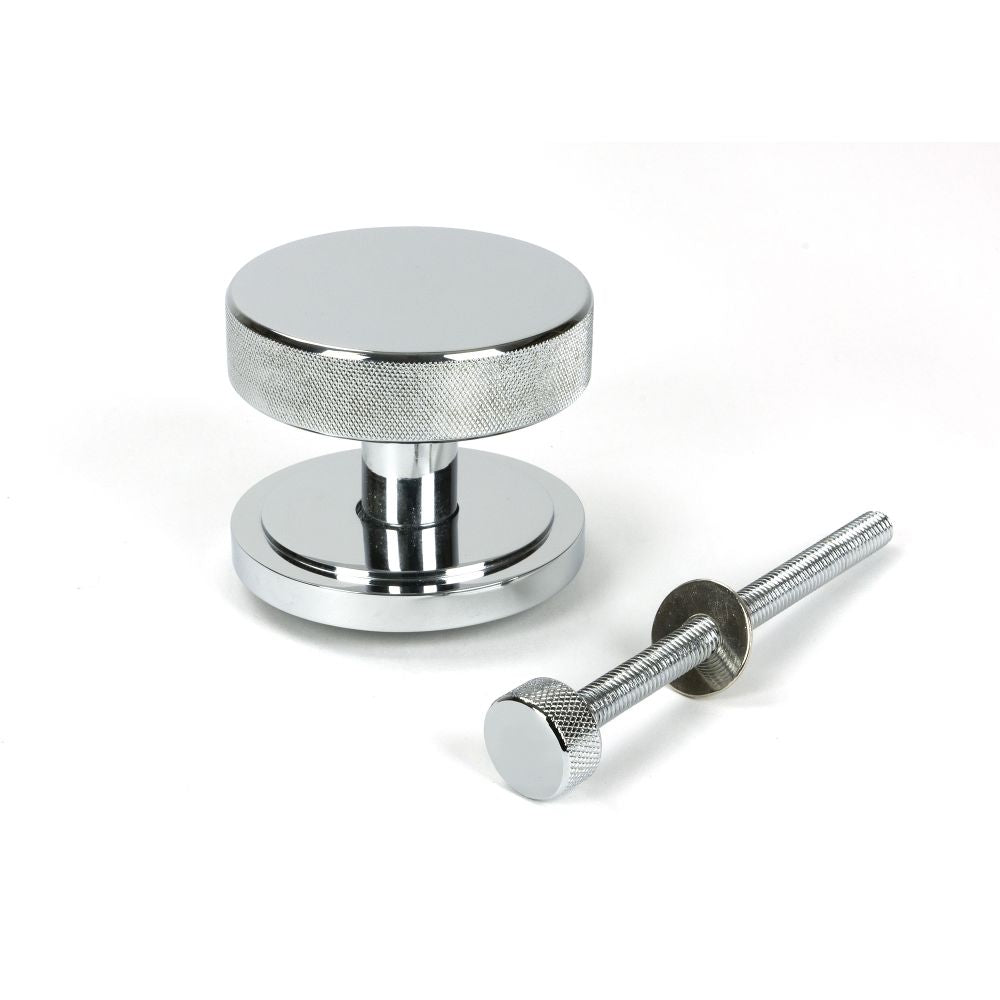 This is an image showing From The Anvil - Polished Chrome Brompton Centre Door Knob (Art Deco) available from trade door handles, quick delivery and discounted prices